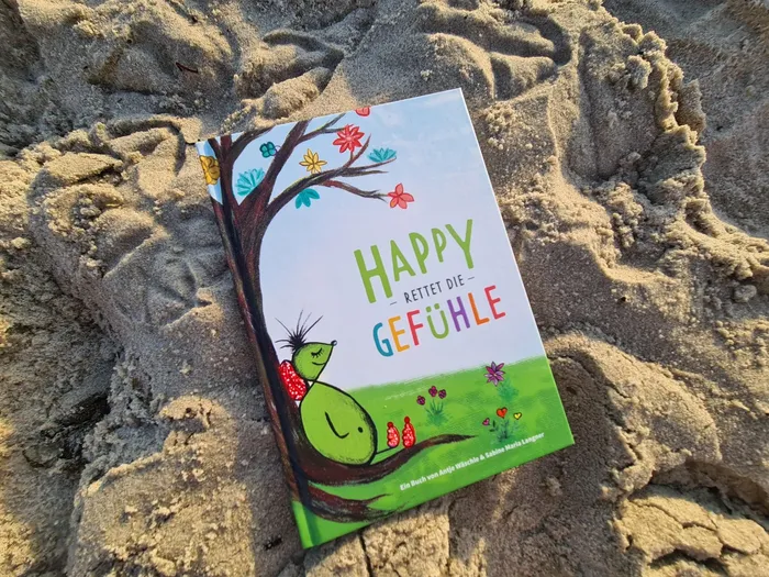 Happy rettet die Gefühle liegt im Sand